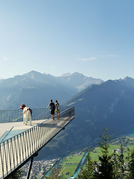 Visitors on a viewing platform overlooking Lake Lucerne and mountains, Mount Rigi, Switzerland.