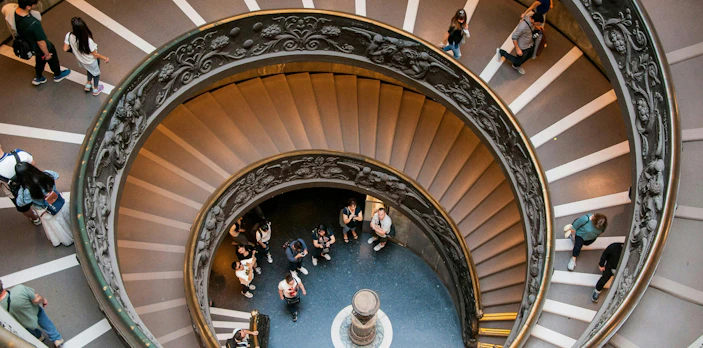 Bramante Staircase spiral with visitors in Vatican Museums, Rome.