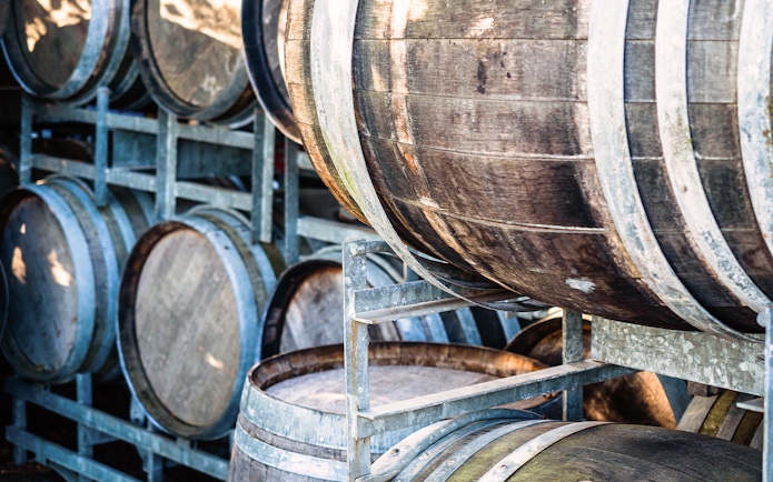 Wooden barrels at a distillery on the Mornington Peninsula tour.