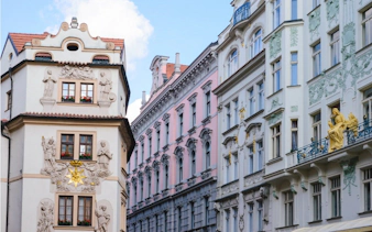 Historic Prague buildings with ornate facades on a self-guided city exploration game route.