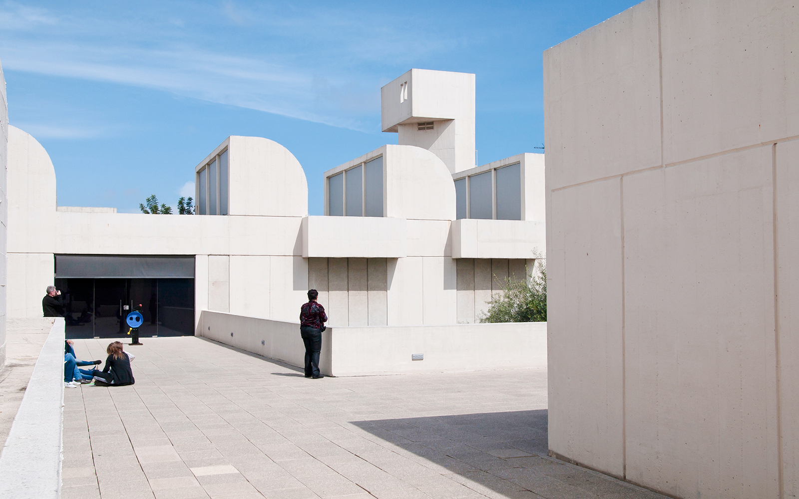 Fundació Joan Miró building exterior on Montjuïc, Barcelona, with visitors exploring.