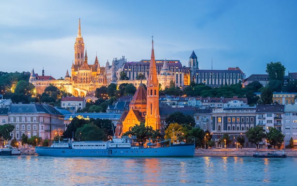 Buda Castle, Matthias Church, and Fisherman's Bastion viewed from Danube River in Budapest.