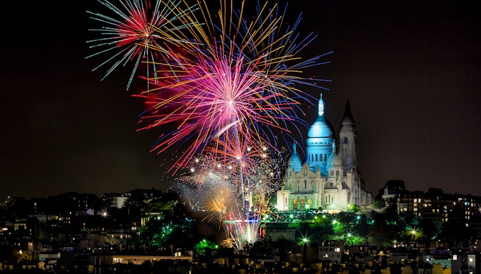 Sacre-Coeur Basilica with fireworks in Paris, France.