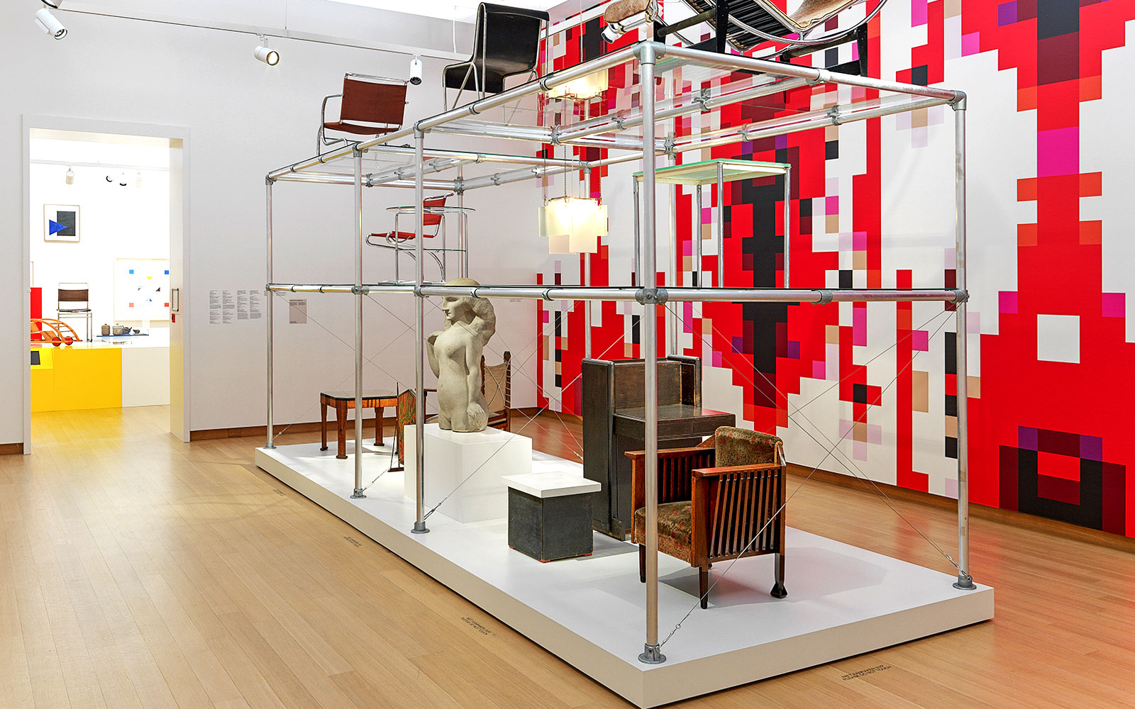 Installation view of "Yesterday Today" exhibit at Stedelijk Museum featuring modern furniture and sculpture.