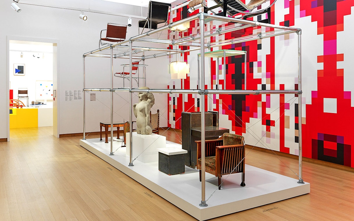 Installation view of "Yesterday Today" exhibit at Stedelijk Museum featuring modern furniture and sculpture.