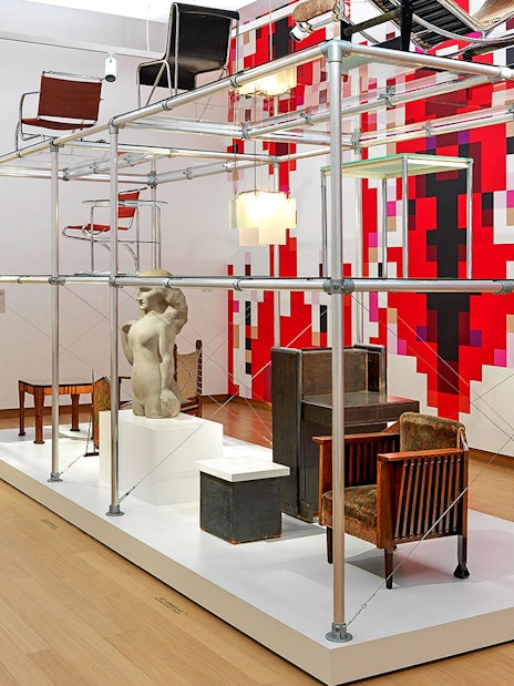 Installation view of "Yesterday Today" exhibit at Stedelijk Museum featuring modern furniture and sculpture.