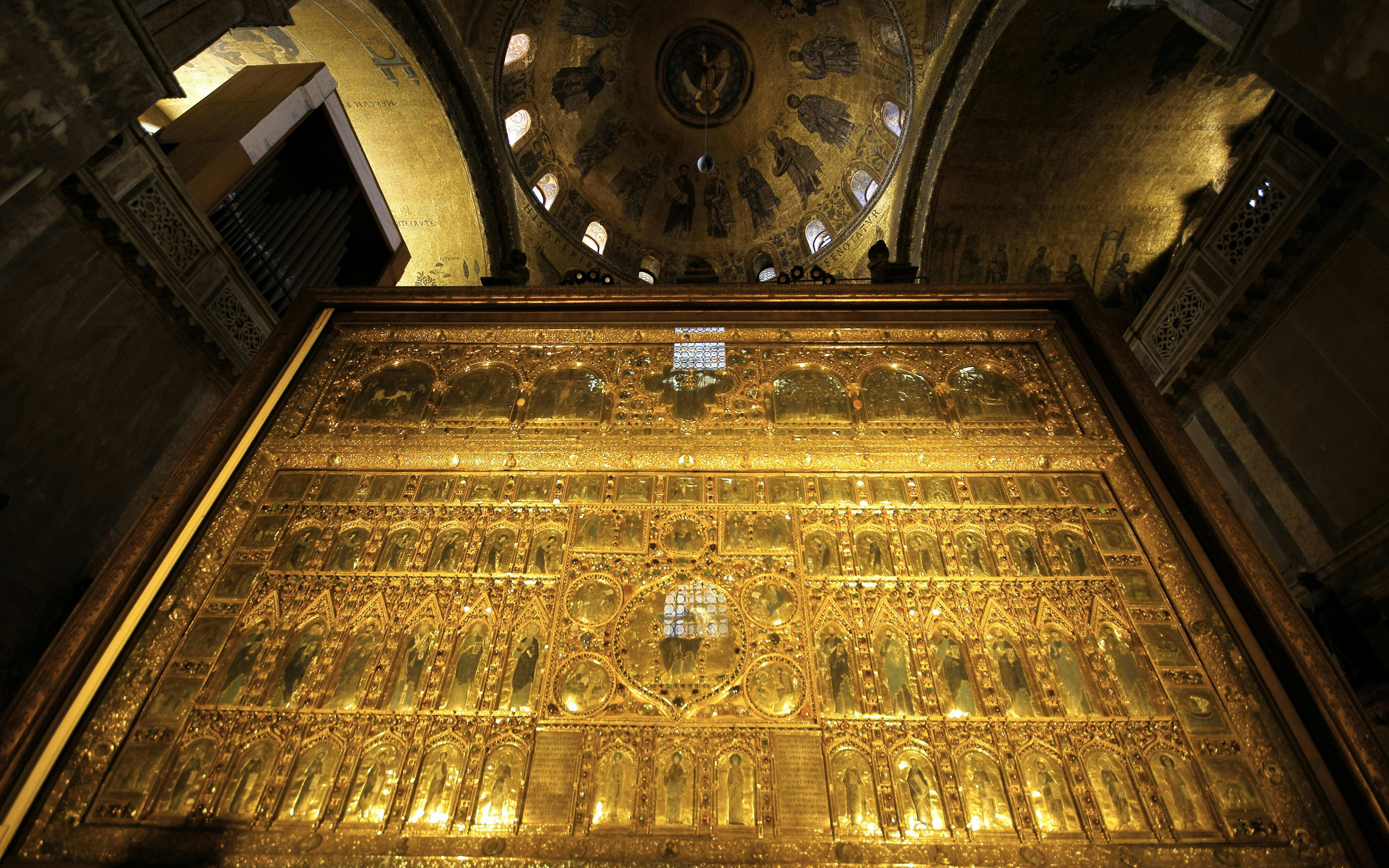 Pala d'Oro altarpiece in St. Mark's Basilica, Venice, showcasing intricate gold and religious iconography.