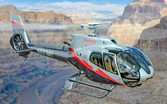 Helicopter flying over Grand Canyon West during Las Vegas tour with canyon landing.