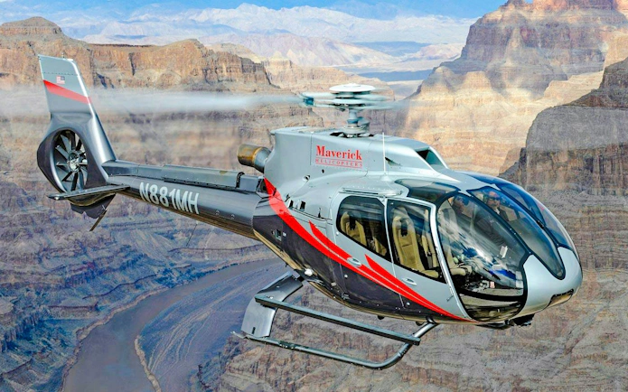 Helicopter flying over Grand Canyon West during Las Vegas tour with canyon landing.