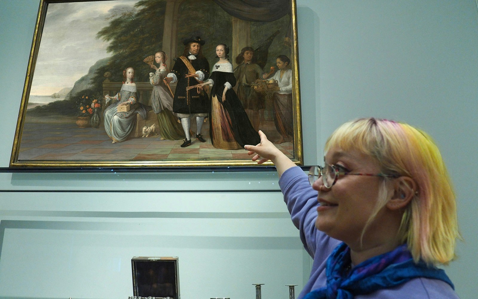 Guide pointing at a painting during Rijksmuseum private tour.