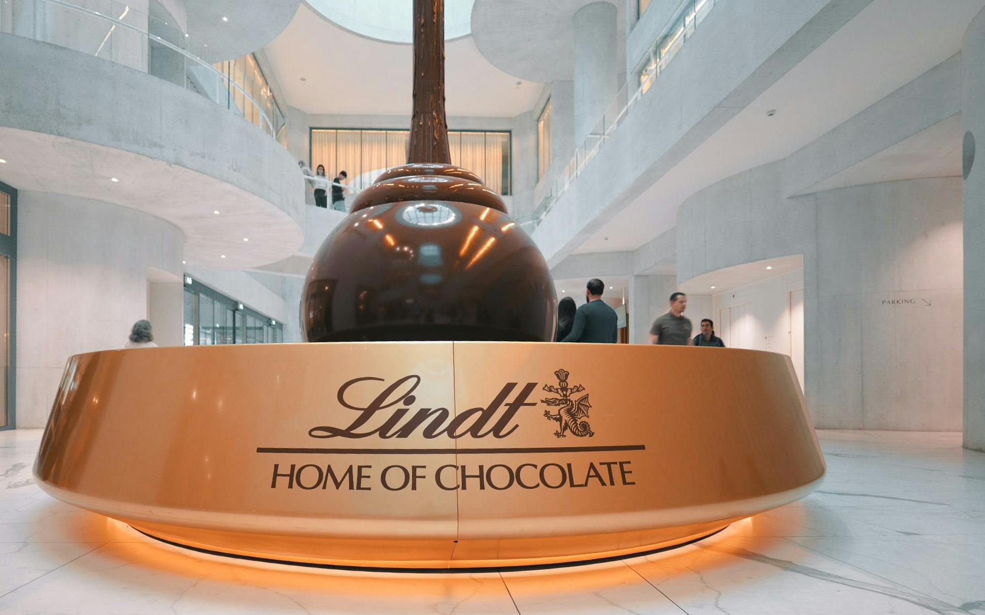 Lindt Chocolate Museum interior with large chocolate fountain centerpiece.