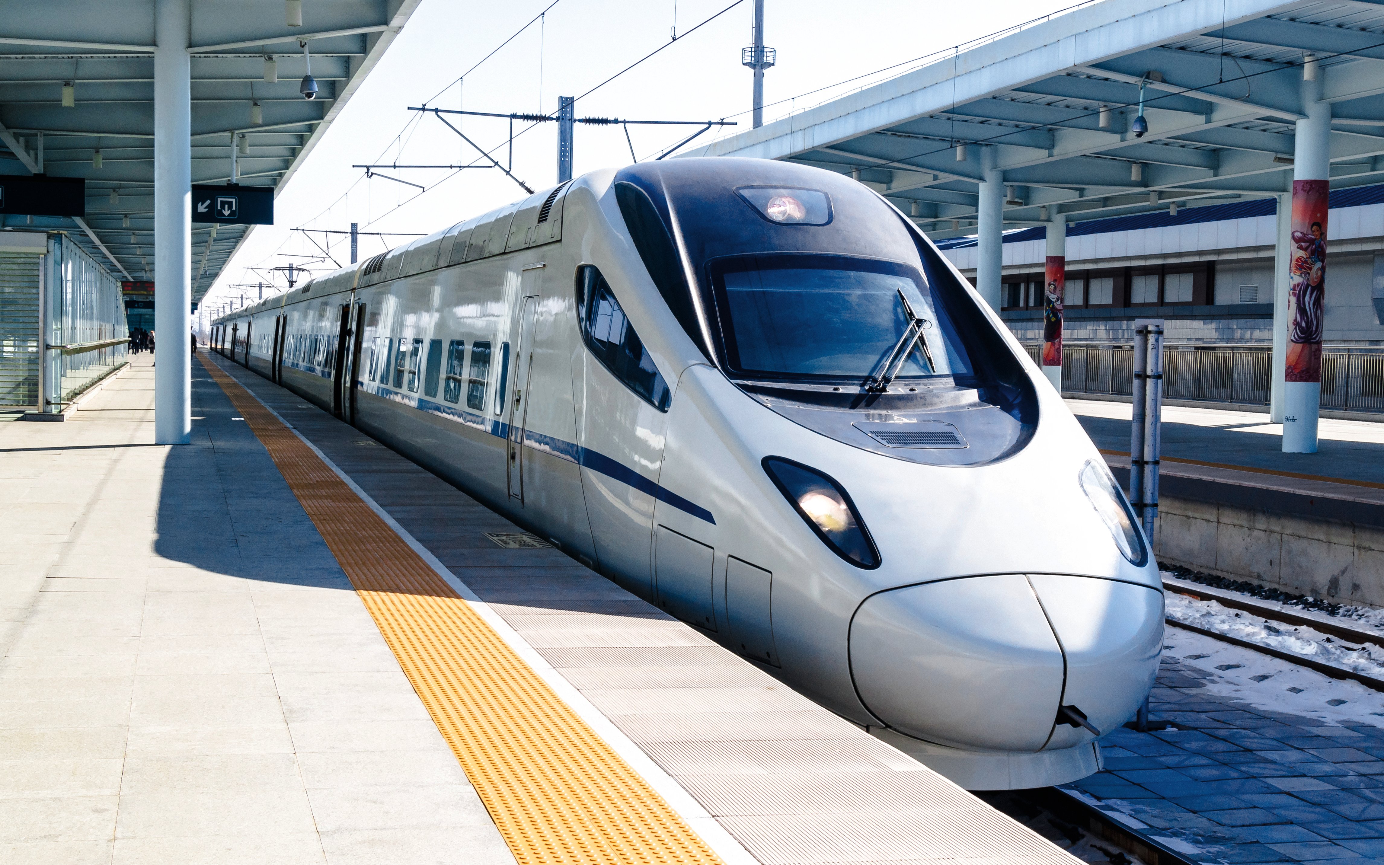 CRH high-speed bullet train at a station platform in China.