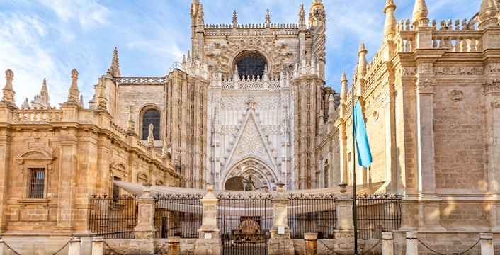Seville Cathedral facade with Gothic architecture details in Seville, Spain.