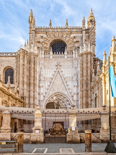 Seville Cathedral facade with Gothic architecture details in Seville, Spain.
