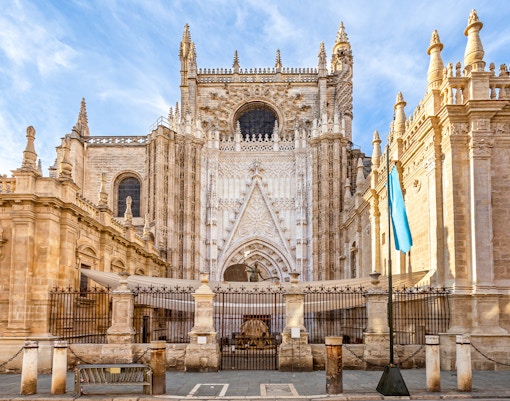 Seville Cathedral facade with Gothic architecture details in Seville, Spain.
