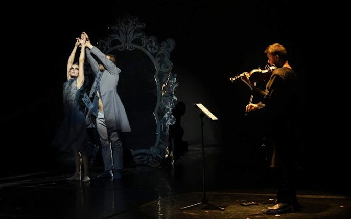 Dancers and violinist performing Vivaldianno The SHOW at Theatre Hybernia, Prague.