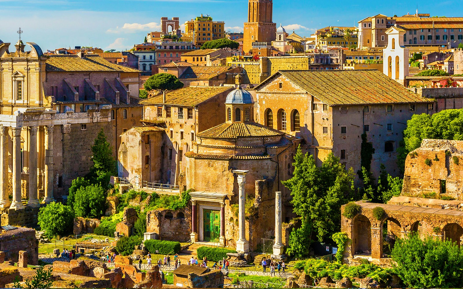 Temple of Romulus in Rome, ancient circular building with columns and green door.