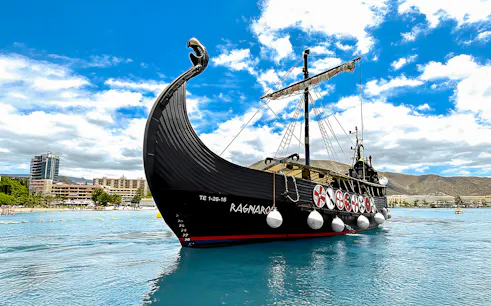 Viking ship on water for whale and dolphin watching cruise.