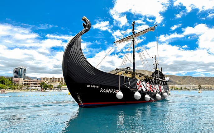 Viking ship on water for whale and dolphin watching cruise.