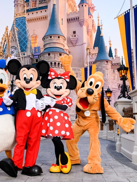 Mickey and friends in front of Cinderella Castle at Magic Kingdom, Walt Disney Resort, Orlando.