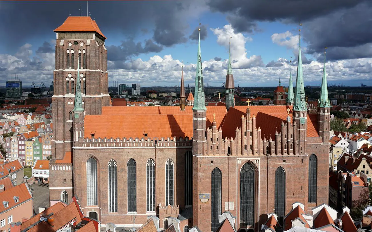 St. Mary's Church with red rooftops in Gdansk Old Town, view from above.