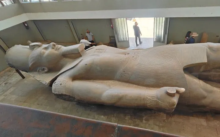 Colossal statue of Ramses II in Memphis, Egypt, viewed during a guided tour.