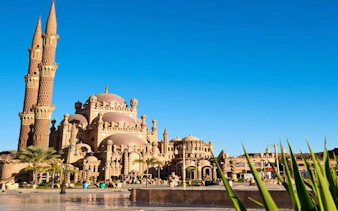 Mosque with ornate domes and minarets in Sharm El Sheikh during private city tour.