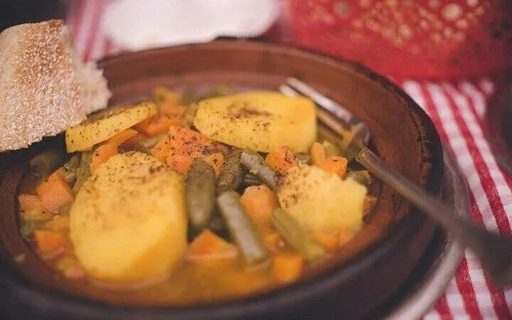 Moroccan vegetable tagine with potatoes and carrots in Marrakesh cooking class.