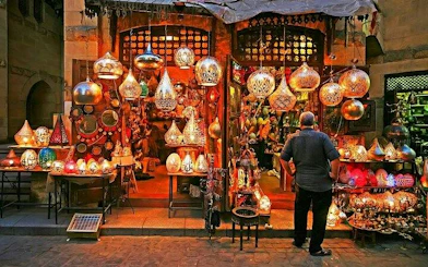 Market stall with traditional lamps in Hurghada bazaar during private guided tour.