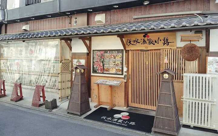 Kyoto Fushimi sake brewery entrance with traditional wooden decor.