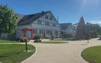 Traditional Swiss building in Appenzell with a sculpture, part of Zurich's Appenzell, Liechtenstein & Heidiland tour.