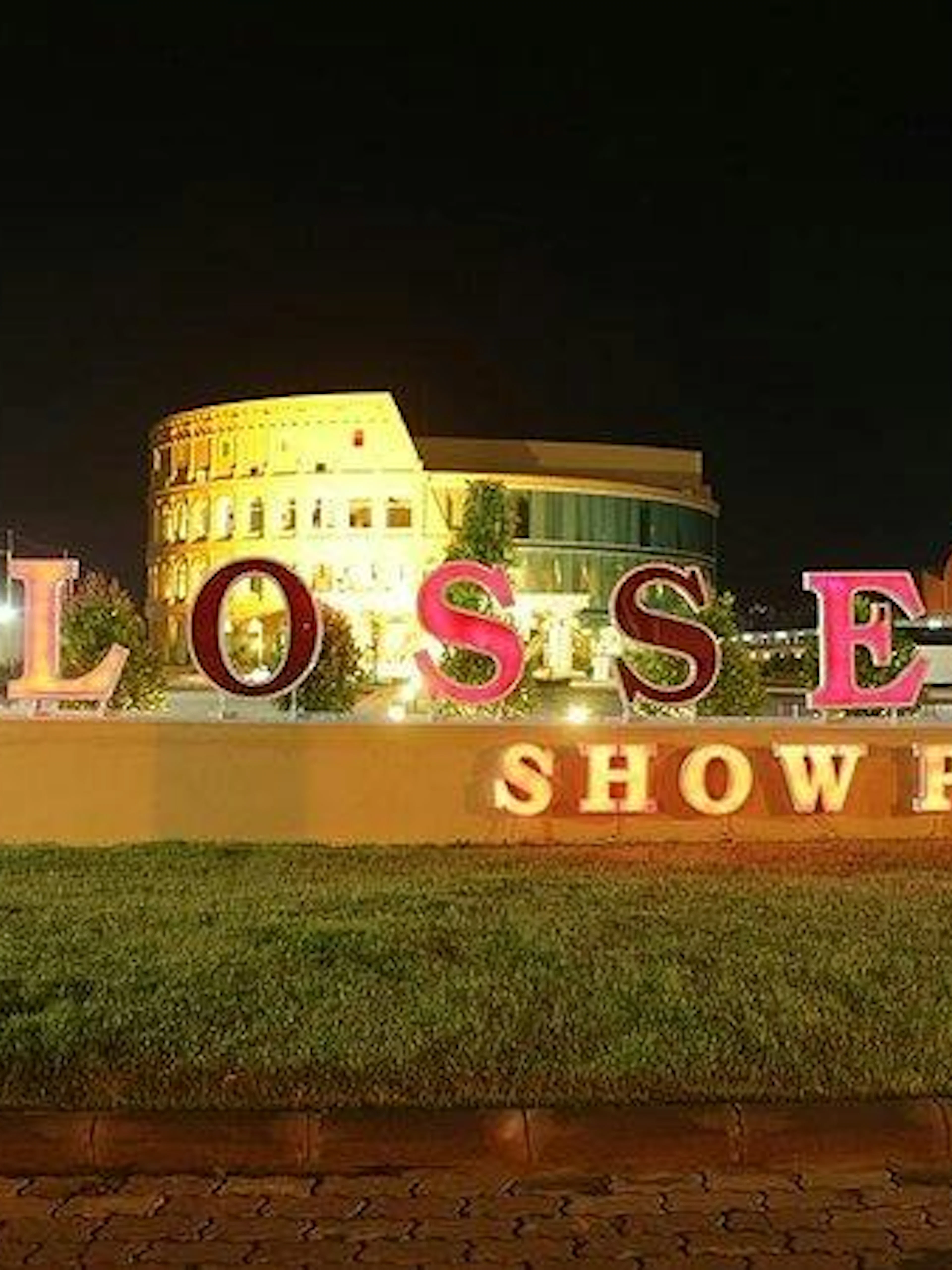 Colosseum Show Pattaya entrance sign illuminated at night, Pattaya.