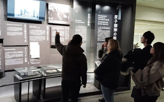 Visitors observing exhibits at Hiroshima Peace Memorial Museum.
