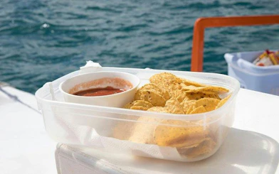 Chips and salsa on a catamaran during a Punta Cana snorkeling tour.
