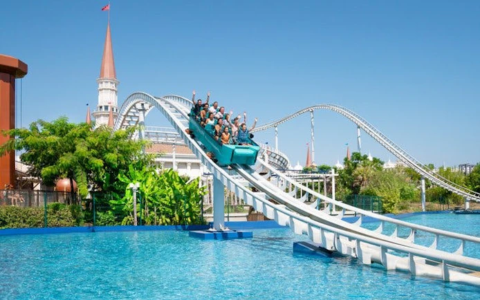 Roller coaster ride over water at The Land of Legends Theme Park, Turkey.