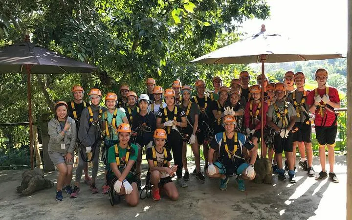 Group of people in harnesses at Phoenix Zipline Adventure Park, Chiang Mai.