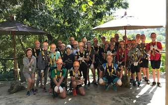 Group of people in harnesses at Phoenix Zipline Adventure Park, Chiang Mai.