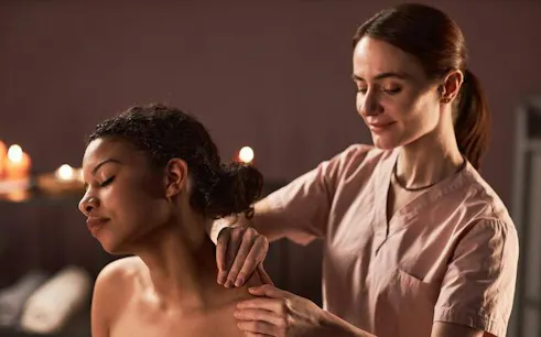 Massage therapist performing shoulder massage at VIP Cleopatra Hamam Bath, Hurghada.