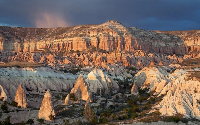 Cappadocia rock formations at sunset during private museum tour.