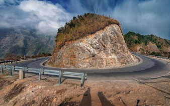 Sa Pa motorbike tour winding road at O Quy Ho Pass, Vietnam.