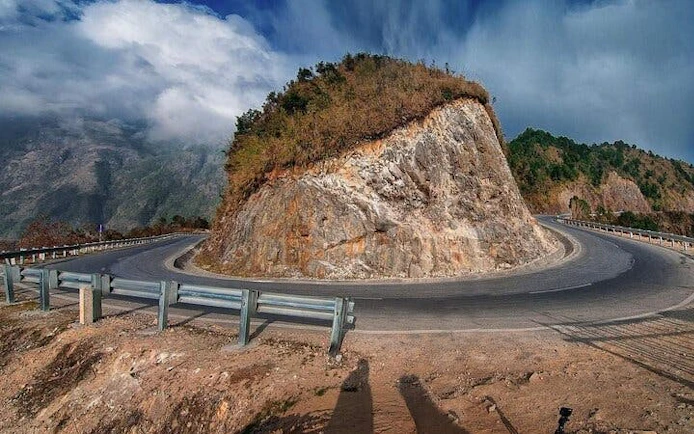 Sa Pa motorbike tour winding road at O Quy Ho Pass, Vietnam.