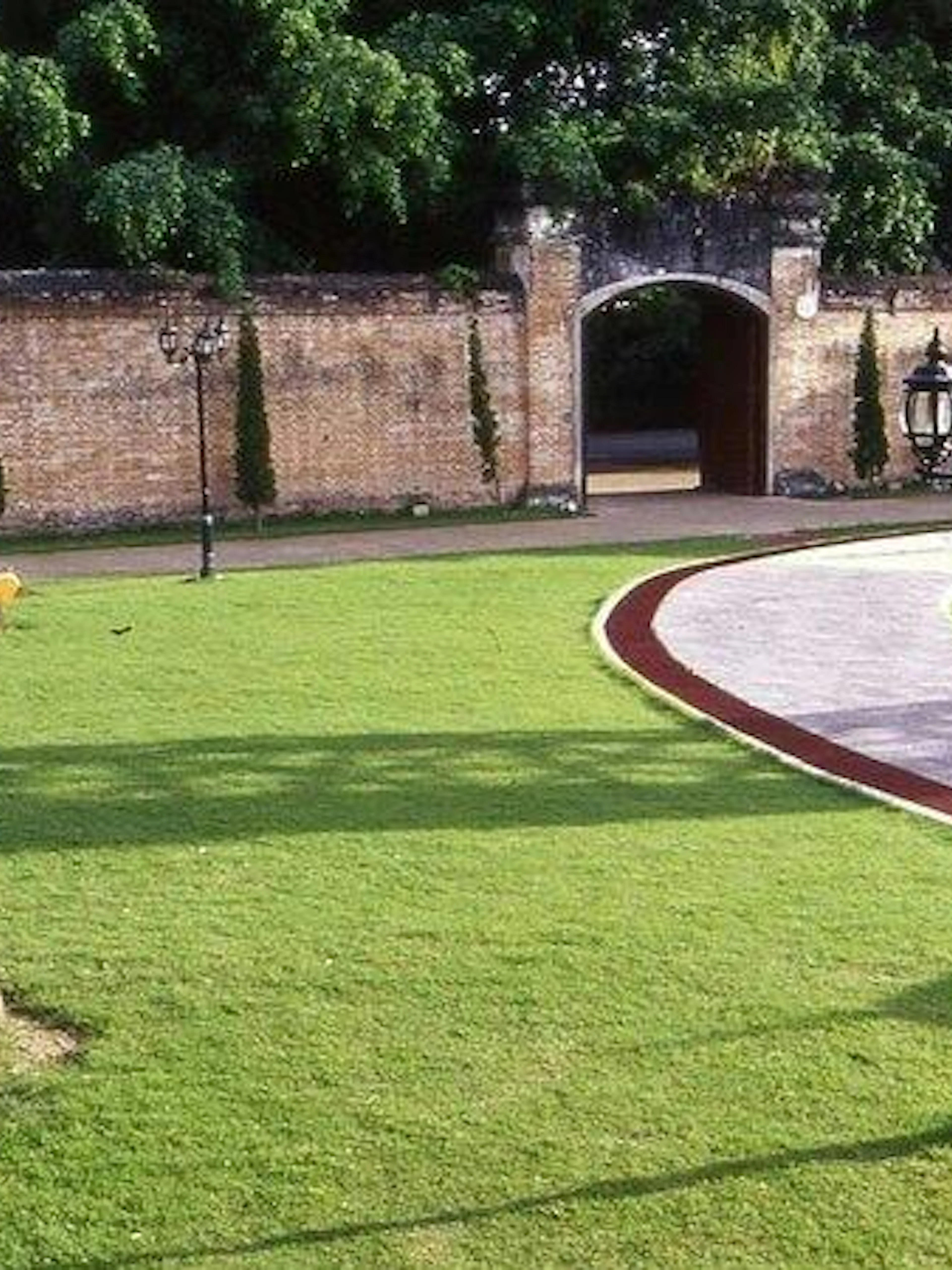 Pathway leading to historic gate in Chiang Rai City tour.