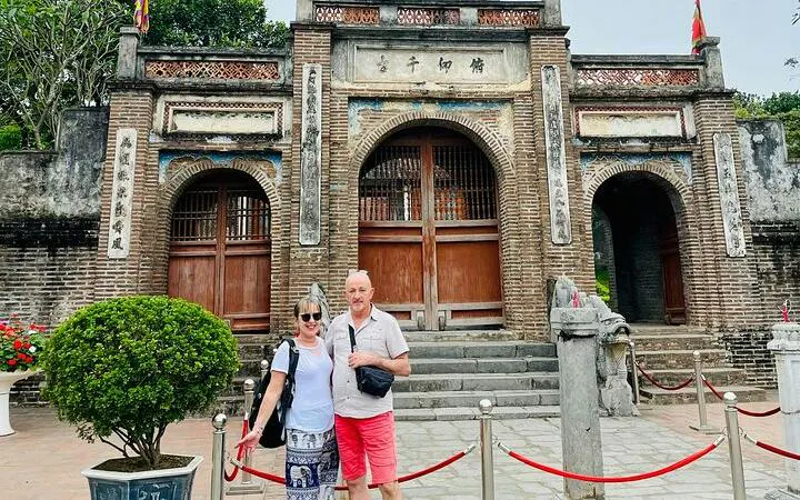 Visitors at Co Loa Citadel entrance, Hanoi, during Vespa tour.