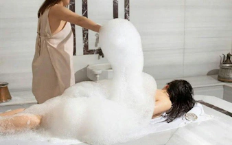 Traditional Turkish bath with foam massage at Alanya Hamam, Turkey.