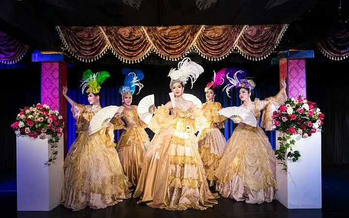 Cabaret performers in ornate costumes on stage at Blue Dragon Cabaret, Krabi.