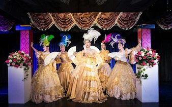 Cabaret performers in ornate costumes on stage at Blue Dragon Cabaret, Krabi.