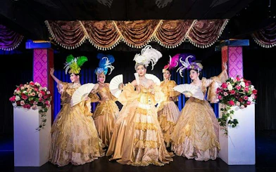 Cabaret performers in ornate costumes on stage at Blue Dragon Cabaret, Krabi.