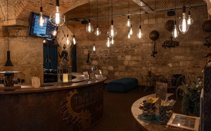 Time Machine Budapest exhibition entrance with vintage decor and hanging lights.
