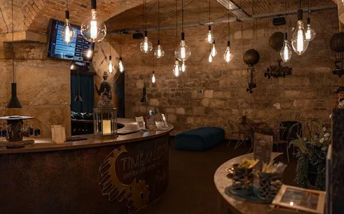 Time Machine Budapest exhibition entrance with vintage decor and hanging lights.