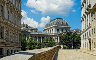 University of Vienna building with ornate architecture on a sunny day, part of a self-guided city exploration game.